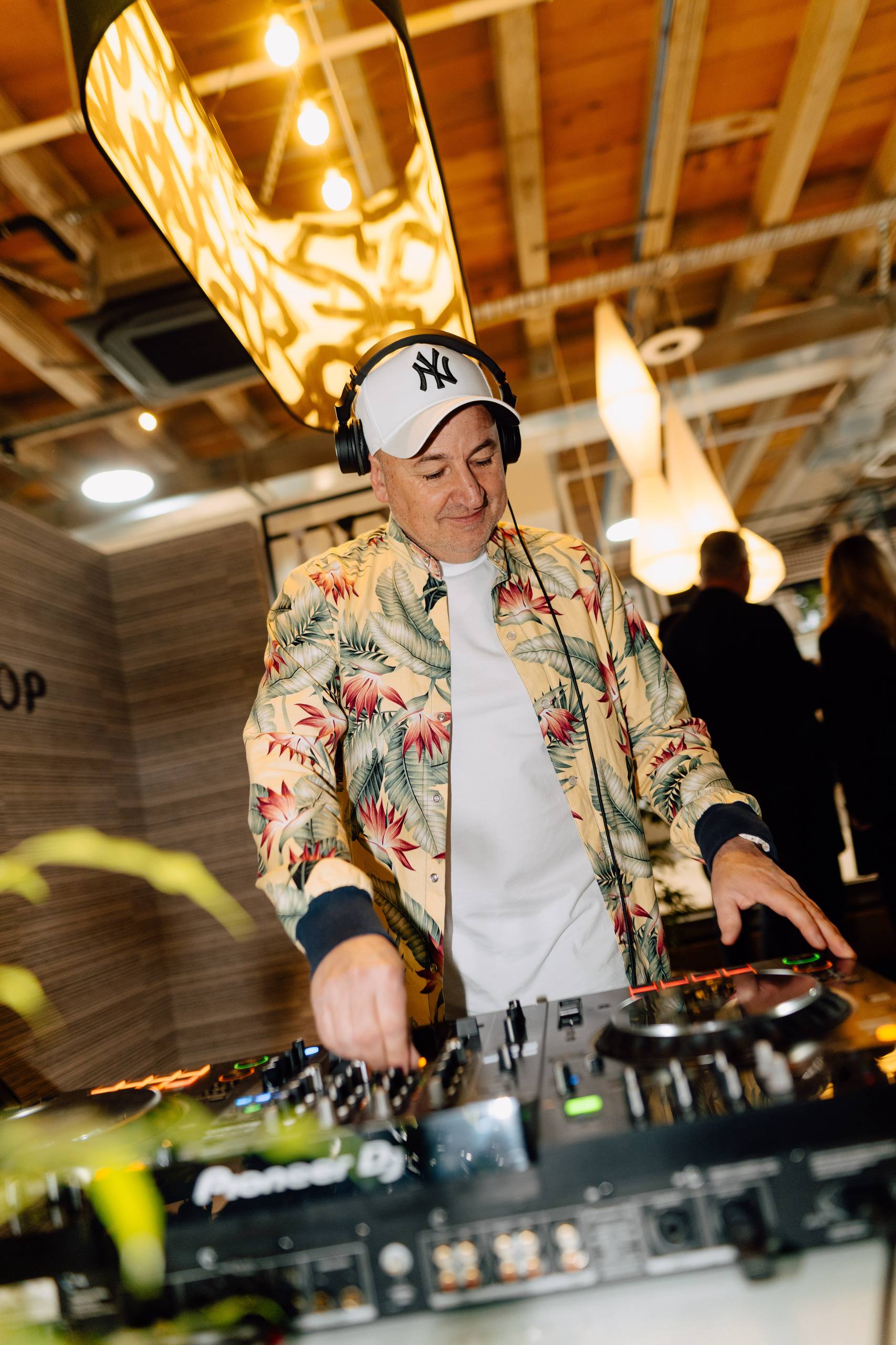 Grant Marshall on the decks in a cap and floral shirt